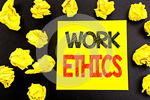 Conceptual hand writing text showing Work Ethics. Business concept for Moral Benefit Principles written on sticky note paper. Fold