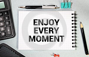 Conceptual handwriting showing Enjoy Every Moment. Business photo text being pleased with your life