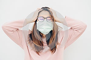 Portrait of sickness Asian woman wearing a mask to protect against infectious diseases from virus or bad pollution from PM2.5 smog