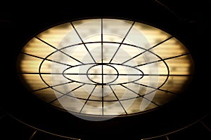 Conceptual high contrast shot of oval lighting at the ceiling