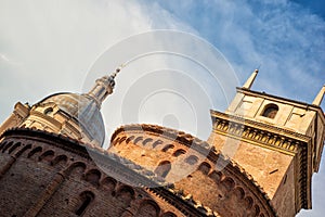 Conceptual horizontal view of rotonda di san lorenzo and bell tower of Basilica in Mantua, Italy in day time with blue sky.