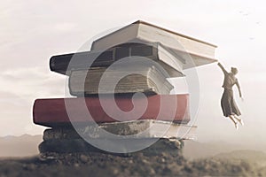 Conceptual image a brave woman climbing a pile of books to reach the top