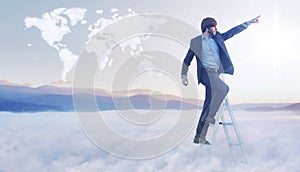 Conceptual image of businessman over the cloud world map