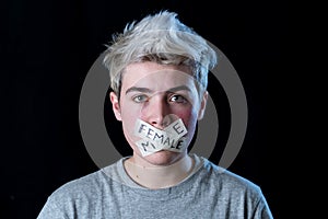 Conceptual image of censorship and gender identity. Transgender teenager with mouth sealed