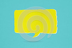 conceptual image about communication and social media, customer feedback,Blank torn grunge yellow speech bubble on rough blue