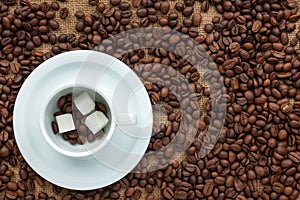 Conceptual image of a cup of coffee and sugar