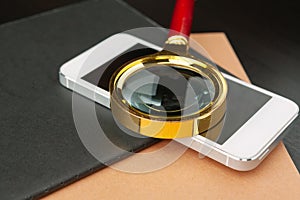 Conceptual image depicting conducting an online search for information with a magnifying glass