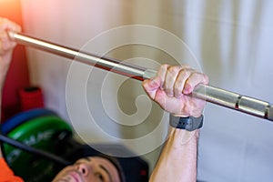 Conceptual image of hand grabbing the weight bar
