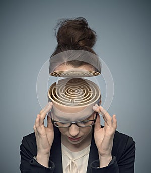 Conceptual image of a maze in the woman's brain photo