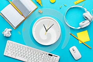 Conceptual image of the office table with wall watch in the center