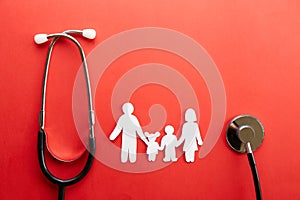 Conceptual image of paper chain in form of family. health insuarance accessories