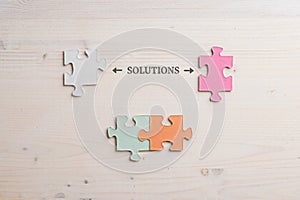 Conceptual image of problem solving with word Solution spelled over wooden background
