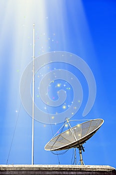 Conceptual image of a satellite dish antenna over night sky with