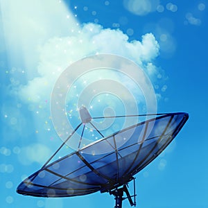 Conceptual image of a satellite dish antenna over night sky with