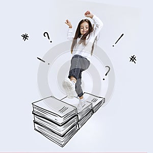 Conceptual image with school age girl stepping on drawn books isolated on grey background. Childhood, dreams