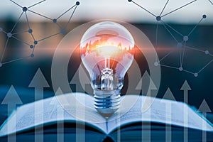 Light bulb idea concept on book with network connection and arrows for innovation and growth