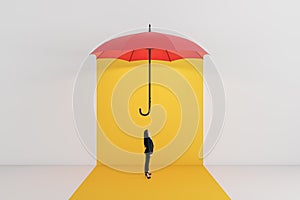A conceptual image of a small person standing under a large, red umbrella suspended above on an isolated background