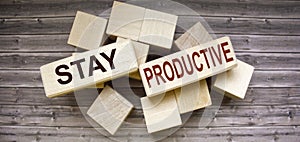 Conceptual image. Text STAY PRODUCTIVE business success concept on wooden blocks