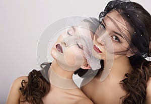 Conceptual Image. Two Fancy Women with Veils