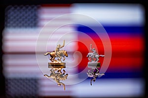 Conceptual image of war between United States and Russia using toy soldiers and national flags