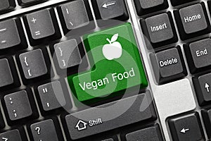 Conceptual keyboard - Vegan Food green key with apple symbol