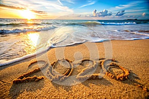 Conceptual photo: New Year 2013 is coming! - inscription 2012 and 2013 on a beach sand photo