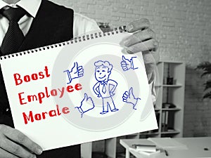 Conceptual photo about Boost Employee Morale with handwritten text photo
