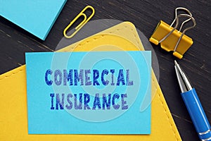 Conceptual photo about COMMERCIAL INSURANCE with handwritten phrase