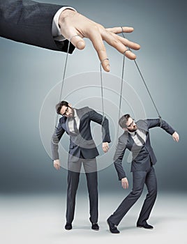 Conceptual photo of controlled employees