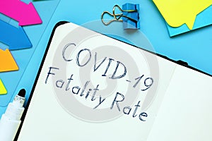 Conceptual photo about covid fatality rate with handwritten phrase photo
