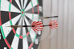 Conceptual photo. Darts on dart board outdoors. Throw darts at the target. The winner, first place. Business target or goal succes