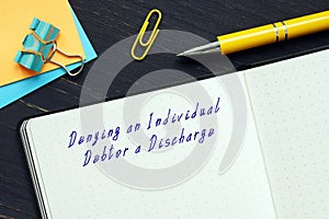 Conceptual photo about Denying an Individual Debtor a Discharge with handwritten text