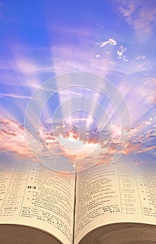 divine spiritual light open holy bible book sky skies sun rays clouds jesus christ jehovah gog heaven photo