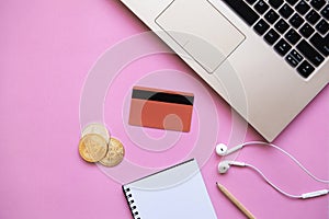 Conceptual photo of e-commerce with credit cards and cryptocurrency.