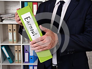 Conceptual photo about Earnout with written phrase