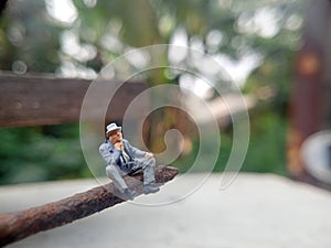 Conceptual Photo, Illustration for Dangerous and Critical Fate, Depression Sitting Man, at Corrosive Nail