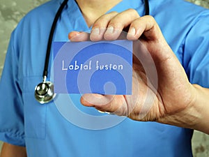 Conceptual photo about Labial fusion with written text photo