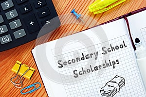 Conceptual photo about Secondary School Scholarships with handwritten text