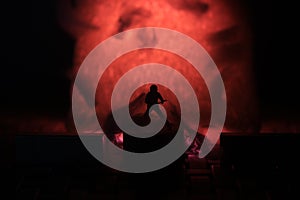 Conceptual Photo, Silhouette Bassist or Guitarist in Action, at Fake Stage, Red Lighting