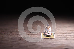 Conceptual Photo, Sitting Muslim, Islam People Reading Al Quran, at Wooden Floor