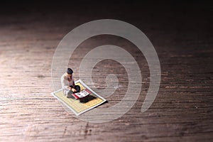 Conceptual Photo, Sitting Muslim, Islam People Reading Al Quran, at Wooden Floor