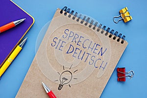 Conceptual photo about Sprechen Sie Deutsch with handwritten phrase photo