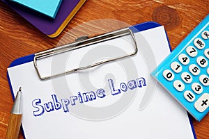 Conceptual photo about Subprime Loan with handwritten text photo