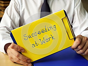 Conceptual photo about Succeeding at Work with written text