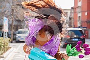 Conceptual photo about windy weather. The wind blows the girl`s hair.