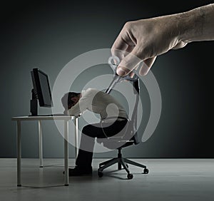 Conceptual portrait of an exhausred office worker being winded up