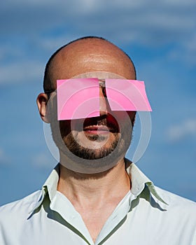 Conceptual portrait of a businessman in modern sunglasses pasted