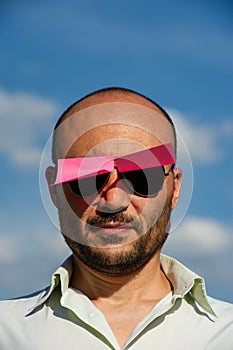 Conceptual portrait of a businessman in modern sunglasses pasted
