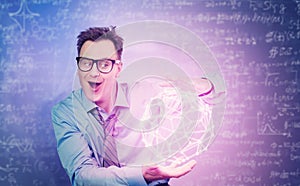 A conceptual portrait of a man with glasses holding a glowing crystal lattice between his hands, on a dark background covered