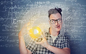 A conceptual portrait of a scientist who holds future thermonuclear energy in his hands, on a blue background covered